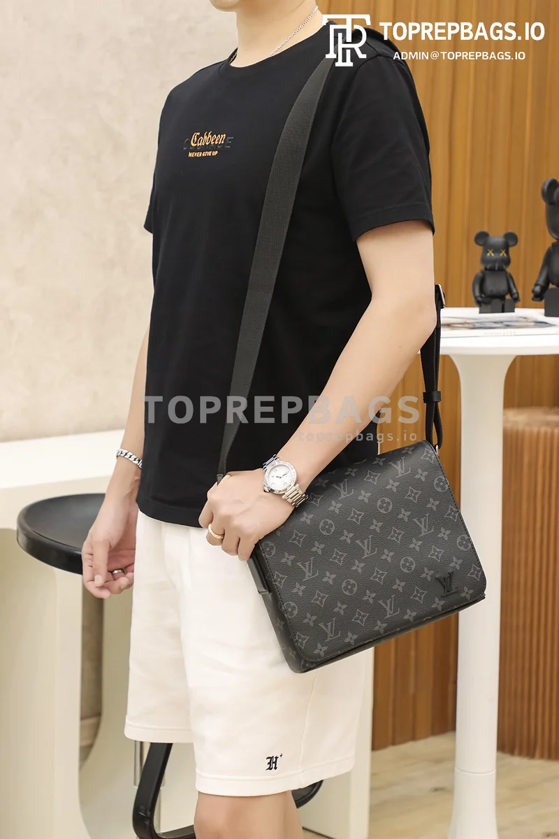 a1627890423276_8877 Louis Vuitton District PM Messenger in Black