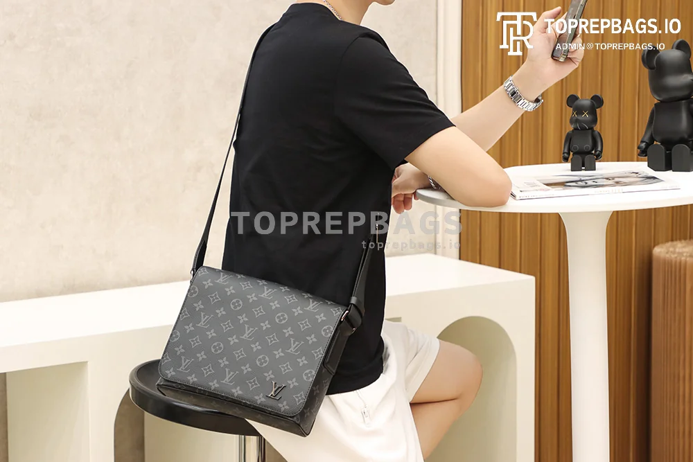 a1627890423284_2164 Louis Vuitton District PM Messenger in Black