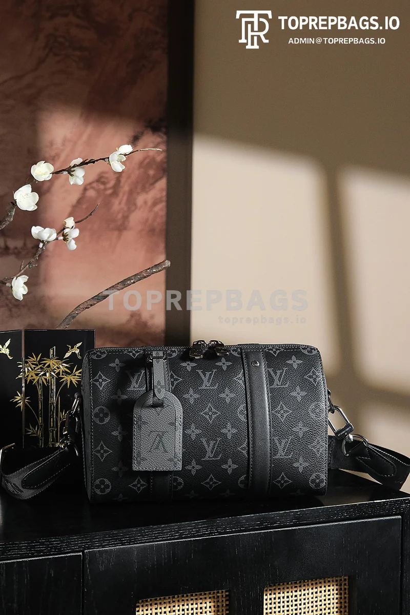 a1743068148667_4641 Louis Vuitton Keepall in Black