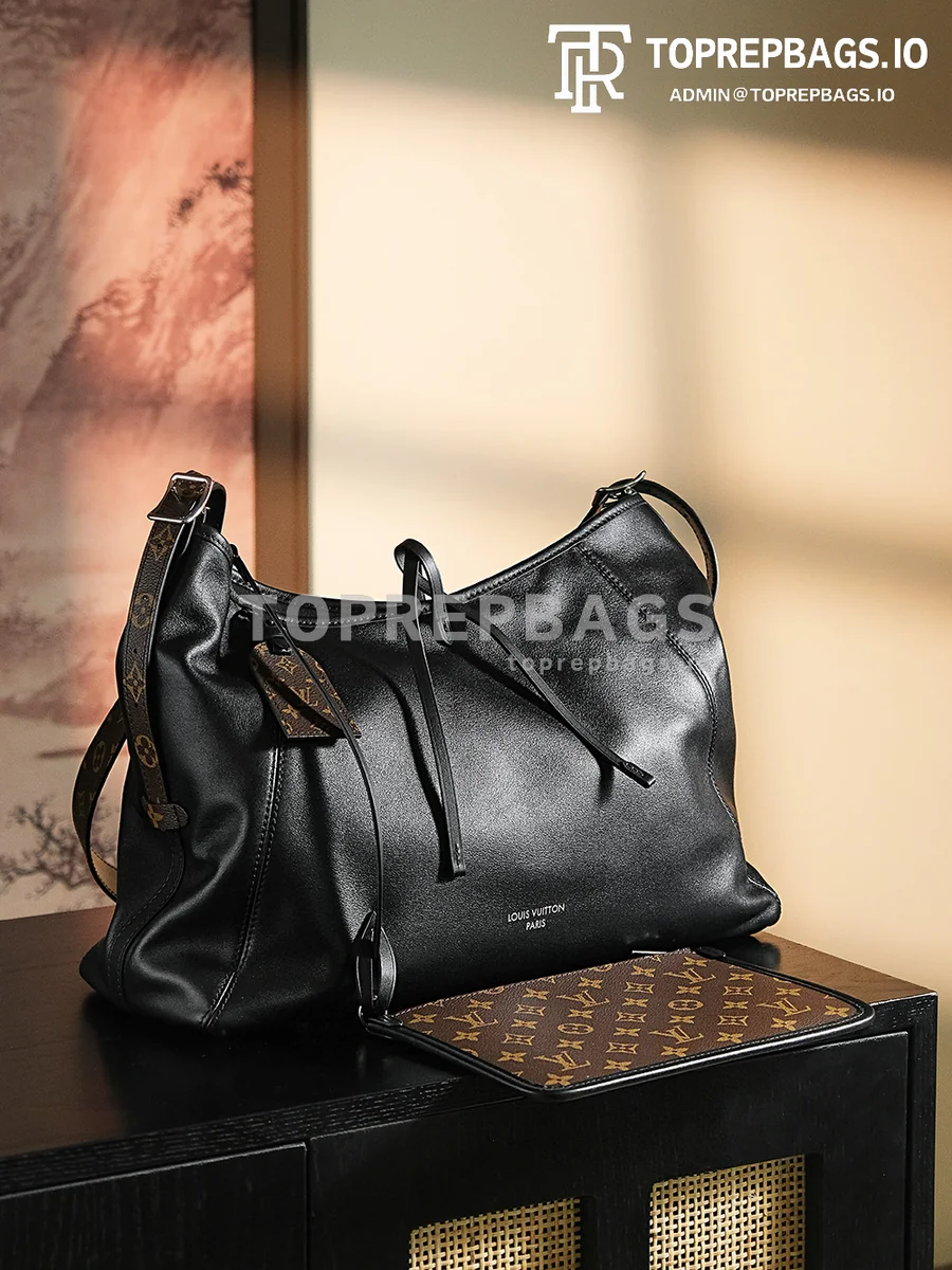 a1717676328399_8302 Louis Vuitton CarryAll in Black