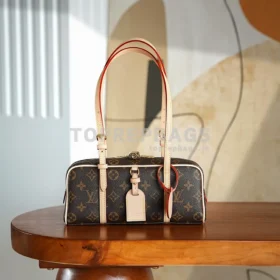 Louis Vuitton Hang On Hobo in Brown