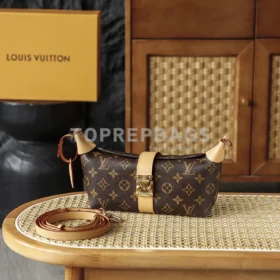 Louis Vuitton Pochette Mia in Brown