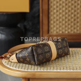 Louis Vuitton Pochette Mia in Brown