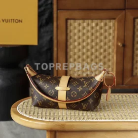Louis Vuitton Pochette Mia in Brown